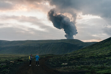 tourist looks at Fagradalsfjall, Iceland - June, 2021: volcano eruption near Reykjavik, Iceland