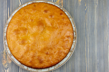 Baked pie on a glass plate.