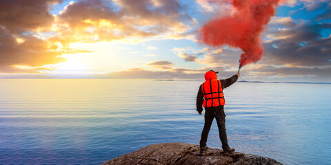 Man gives SOS signal. Person on seashore blows red smoke. Concept of distress and search for help. Human in orange vest is signaling for help. Man with flue on sea shore. Metaphor for need for support