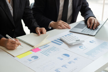 Business leaders talk about charts, financial graphs showing results are analyzing and calculating planning strategies, business success building processes