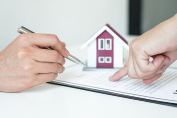 Real estate agents offer sale home insurance and close the sale immediately after the customer signs a purchase contract under a formal agreement. Real estate Home insurance concept
