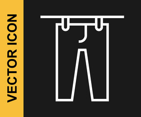 White line Drying clothes icon isolated on black background. Clean pants. Wash clothes on a rope with clothespins. Clothing care and tidiness. Vector