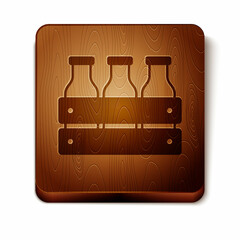 Brown Bottled milk packed in wooden box icon isolated on white background. Wooden square button. Vector