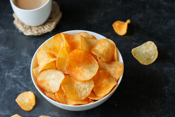 spicy masala tapioca chips Keripik singkong or Cassava chips Indian milk tea chai India Indonesia Brazil Sri Lanka Kerala fried snacks food tea time food fried in coconut oil