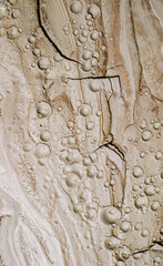 Small craters in mud volcanoes's clay river. Buzau county, Romania.