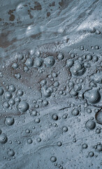 Small craters in mud volcanoes's clay river. Buzau county, Romania.