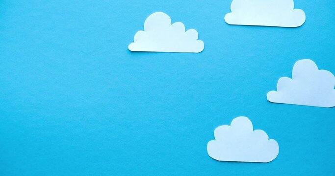 Scattering paper clouds. 4K stop motion animation