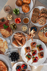 Dishes with different food on table, flat lay. Luxury brunch
