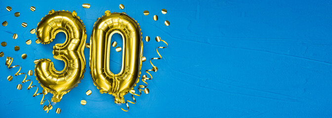 golden foil balloon number thirty. Birthday or anniversary card with the inscription 30. blue...