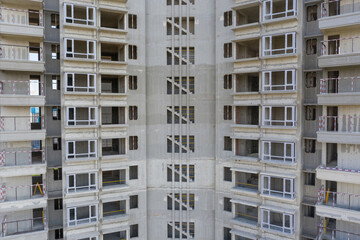 Fototapeta premium Concrete structure high-rise rough building apartment building
