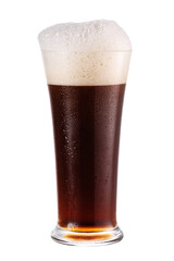 Cold glass of dark beer with foam isolated on white background.