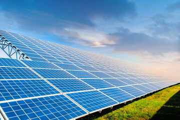 Solar panels on the sky background. Solar power plant. Blue solar panels. Alternative source of...