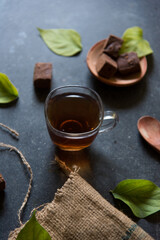 Energy drink black tea served in a cup. Close up.