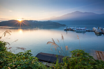 Asia culture - Beautiful landscape of lake level reflect fantasy dramatic sunrise sky in Sun Moon Lake , in Taiwan, Asia. the famous travel attractions in Nantou ,Taiwan. Scenery of Sun Moon Lake,