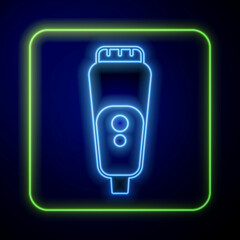 Glowing neon Electric razor blade for men icon isolated on blue background. Electric shaver. Vector