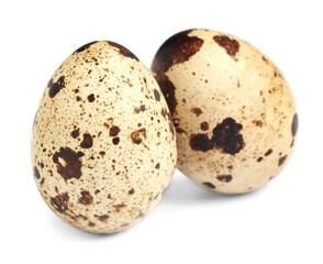 Fototapeta premium Two beautiful quail eggs on white background