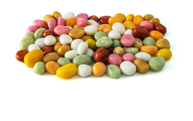dragees candy multicolored sea pebbles on a white background