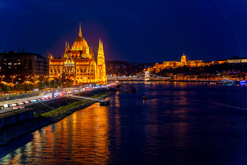 Fototapeta premium Hungary, budapest. Wonderful architecture at night. Beautiful landscape on the parliament on the river. Wonderful mesmerizing view of the city at night illuminated by lights on the danube river