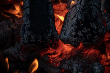 close-up of burning firewood wisth small flame