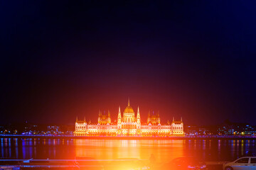 Beautiful architecture illuminated by lanterns. A magical view of the ancient city. A beautiful old building on the danube river. Hungarian parliament building at night, budapest, hungary