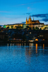 Beautiful prague castle and charles bridge over the river at night in lights in prague.