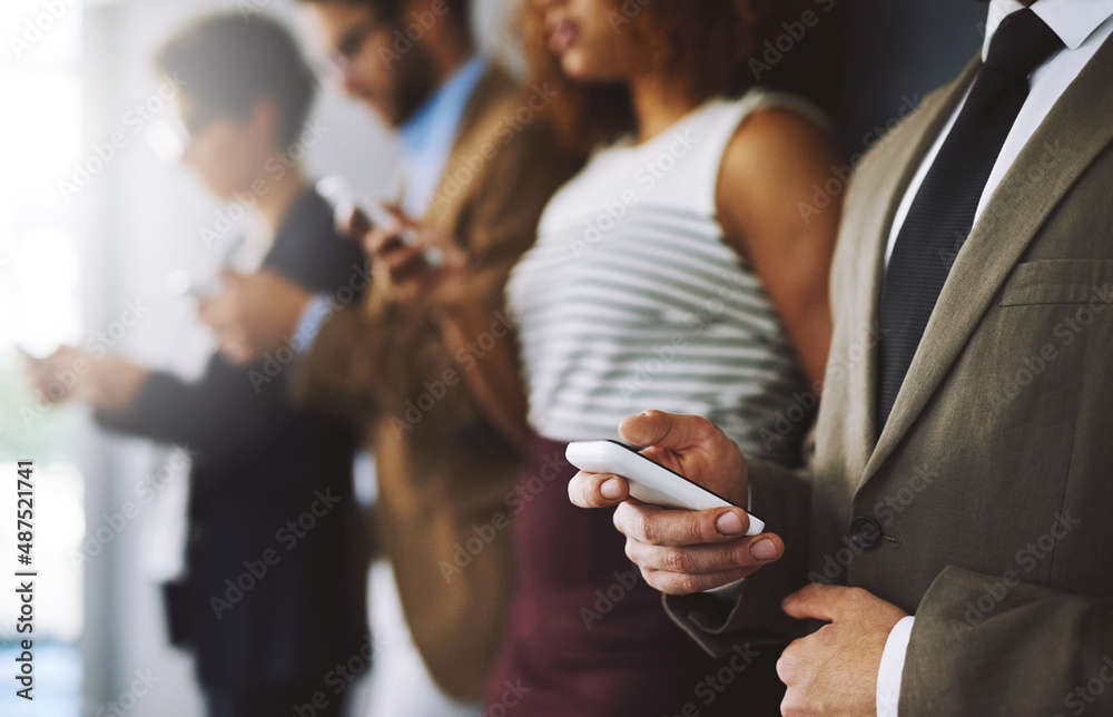 Poster keep track of industry developments just by logging in. shot of a businessperson using his cellphone