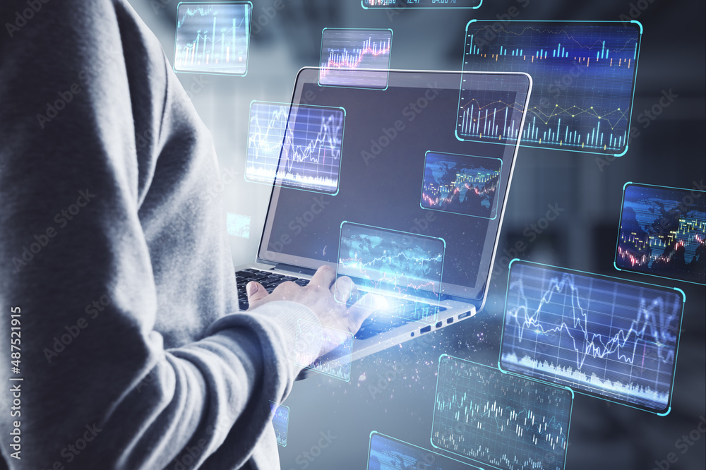 Poster Hacker in hoodie using laptop computer with various forex screens on blurry office interior background. Cryptocurrency, hacking, bticoin trading and finance concept. Double exposure.