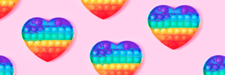 Banner from pop it toy isolated on pink background.