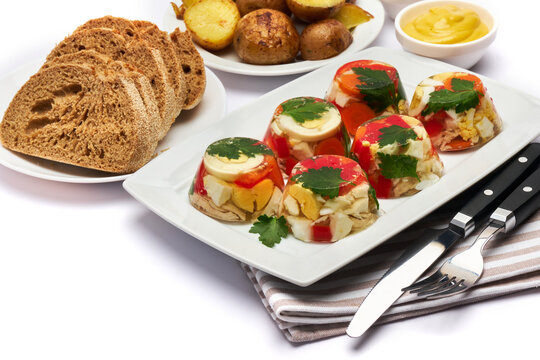 Portion of delicious chicken aspic on a plate isolated on white background