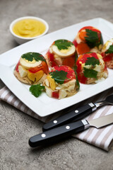 Portion of delicious chicken aspic on a plate isolated on concrete table