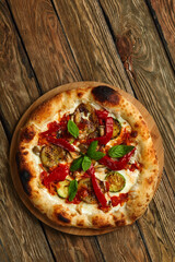 pizza vegetables tomato, onion, pickles, mushrooms, etc. vegan or vegetarian food ready to eat no meat portion on the table for healthy meal snack outdoor top view copy space food background rustic