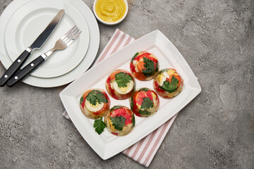 Portion of delicious chicken aspic on a plate isolated on concrete table