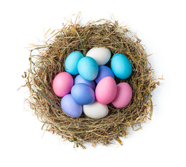 Naklejka na ściany i meble Bird's nest with colored Easter eggs isolated on a white background.