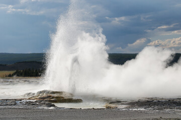 Fototapeta premium Yellowstone National Park. Spooky portion of landscape in Yellowstone National Park featuring a desert area caused by acidic soil and erupting geysers.