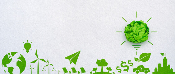 Green crumpled paper light bulb with energy environment icons on white background, Corporate Social Responsibility (CSR), eco-friendly business concept © Worawut