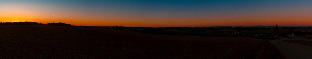 Obraz premium High resolution stitched panorama of a beautiful sunset at Eichendorf, Bavaria, Germany