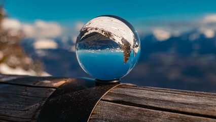 Crystal ball alpine landscape shot at the famous Rossfeld panorama road near Berchtesgaden,...