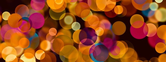 Orange overlapping pastel circles on the black background, circular overlays graphic, blurred backward elements, bubbles