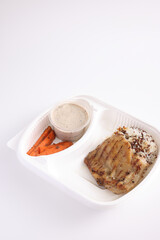 Grilled chicken with rice with delivery take home package isolated in white background