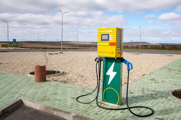 Front view of an electric vehicle charging station in the countryside