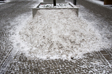 Fototapeta na wymiar snow heap on street