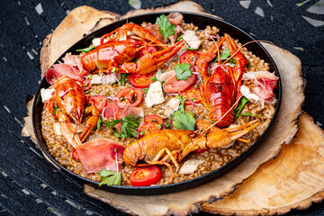 Gourmet seafood paella with pink marine prawns and mussels