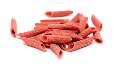Dry Penne pasta with natural red beetroot coloring isolated on white background