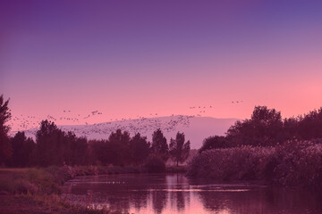 Mountain landscape in the evening. Beautiful lake against mountains. The Hula Valley in northern Israel