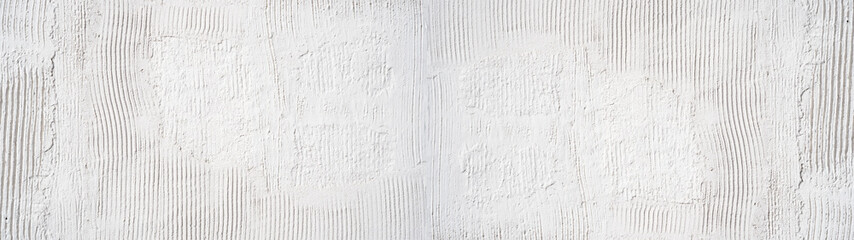 White rough filler plaster facade wall texture background.banner panorama, with vertical line corrugation