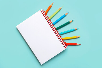 Spiral notebook with colored pencils and with copy space for your image or text