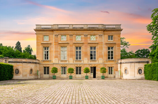Petit Trianon in Versailles park outside Paris at sunset, France