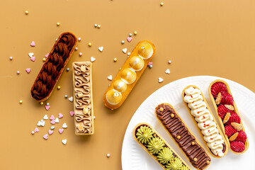 Eclairs with pistachio raspberries and chocolate cream topping