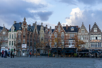 Typical houses of Ghent, located in a square, on a very cloudy day with rain