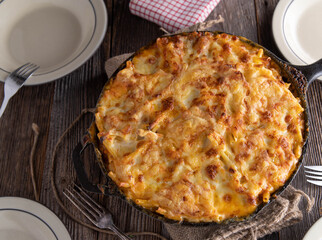 Macaroni casserole with bolognese sauce, bechamel sauce and cheese topping